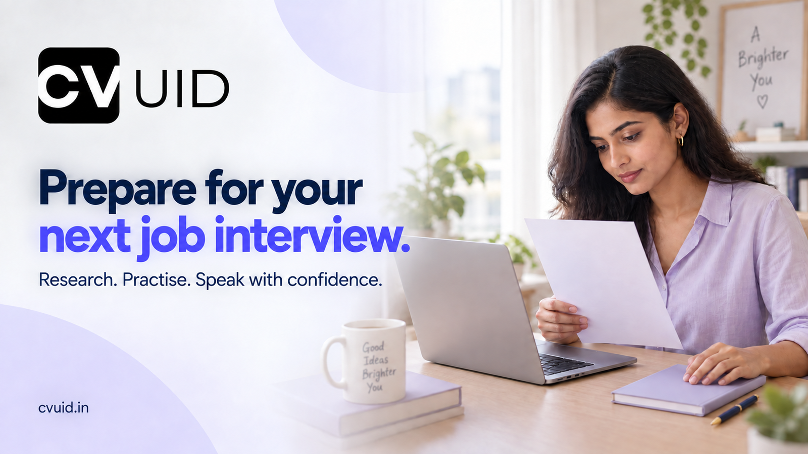 A candidate reviews a CV beside a laptop and closed notebook while preparing for a job interview.